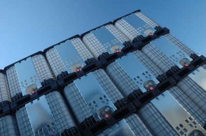 Stacked IBCs against a blue sky