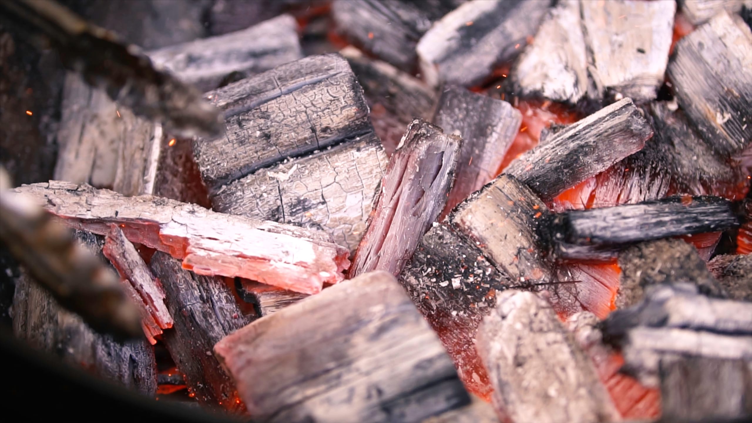 Burning charcoal and woods chips on a barbecue