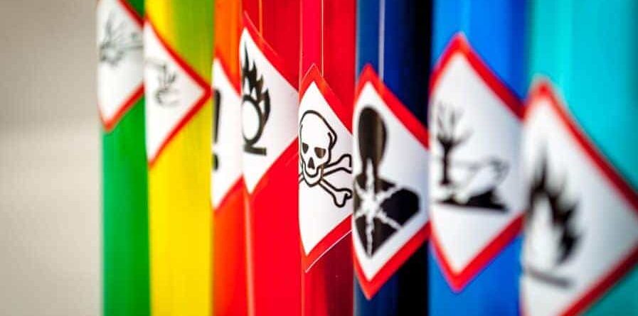 Hazard labels on coloured pipes