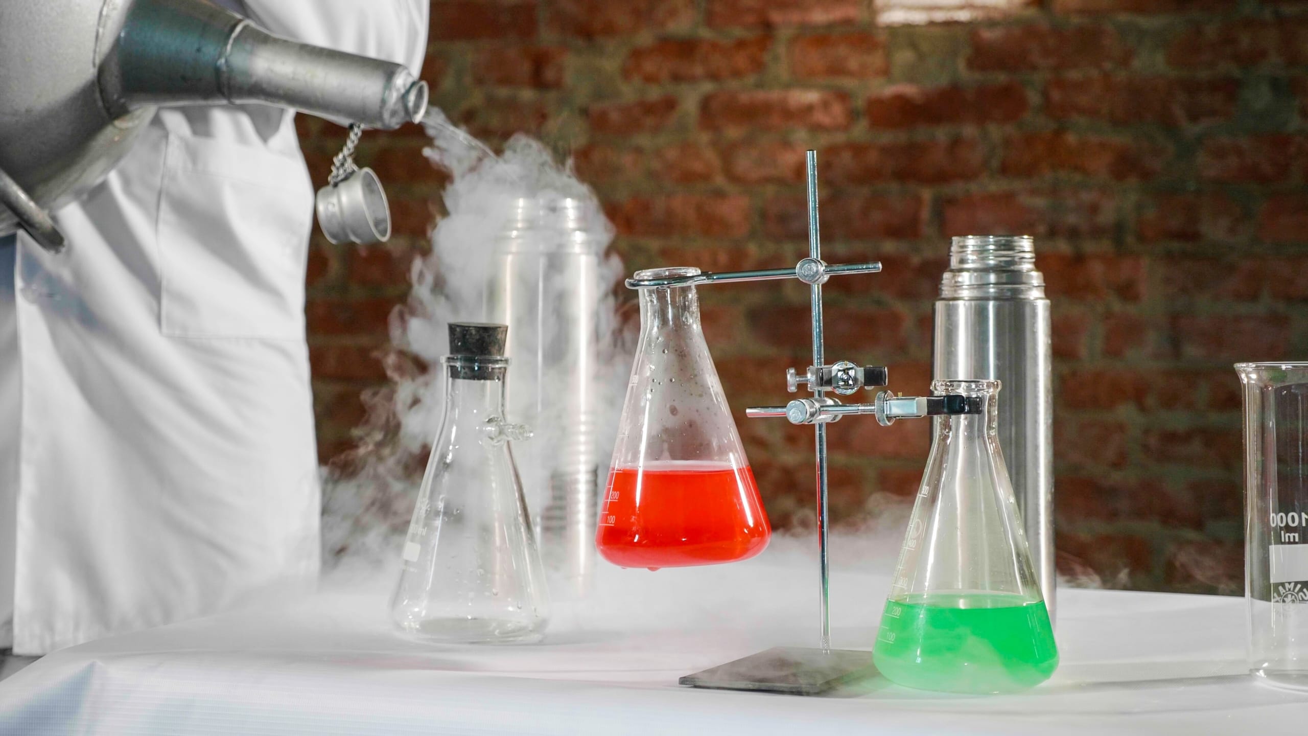 Beakers and smoke demonstrating temperature control in chemistry
