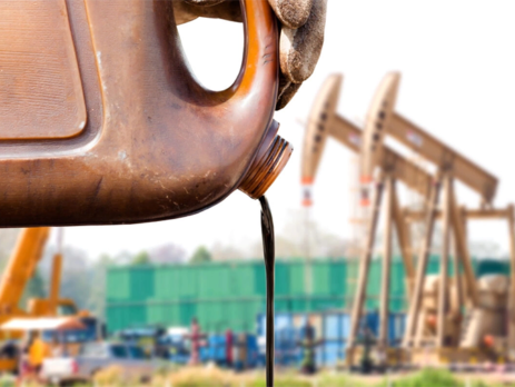 Crude oil being poured||A diagram highlighting oxygen processing||A biogas plant located behind a rape field||A pile of raw cow manure
