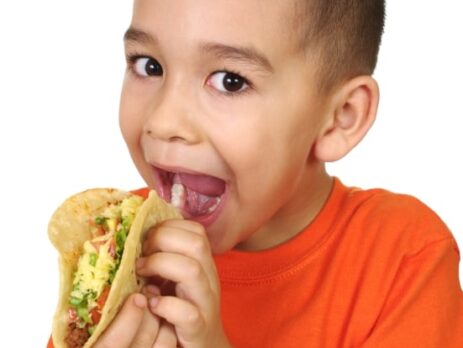 Child eating a taco