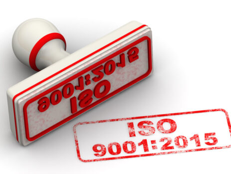 3D illustration of a rubber stamp with the text ISO 9001