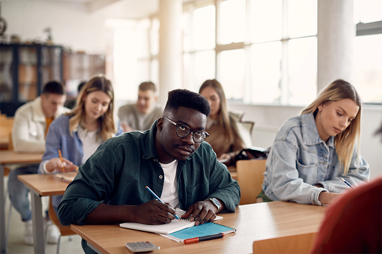 University students taking notes during a lecture