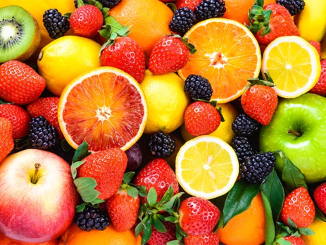 Fresh fruit, including oranges, apples, grapefruit, strawberries, and kiwi