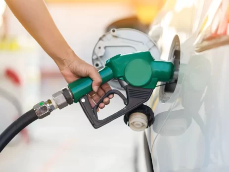 A Person filling a Car with Petrol