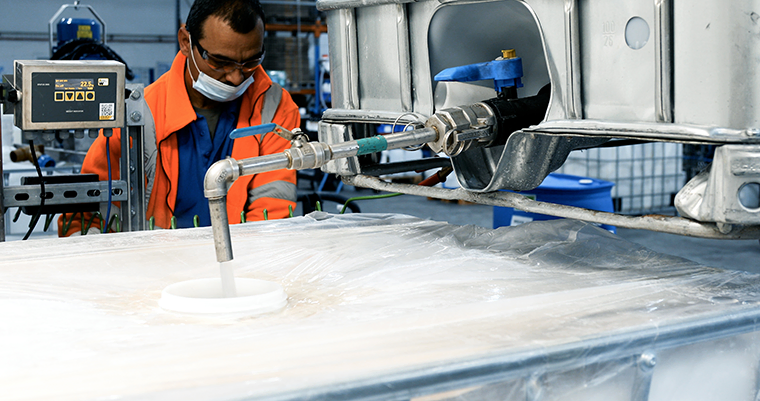 Raw material being dispensed into an IBC