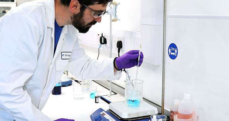 A ReAgent Chemist working with samples in the lab