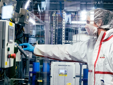 ReAgent employee wearing PPE in a cleanroom