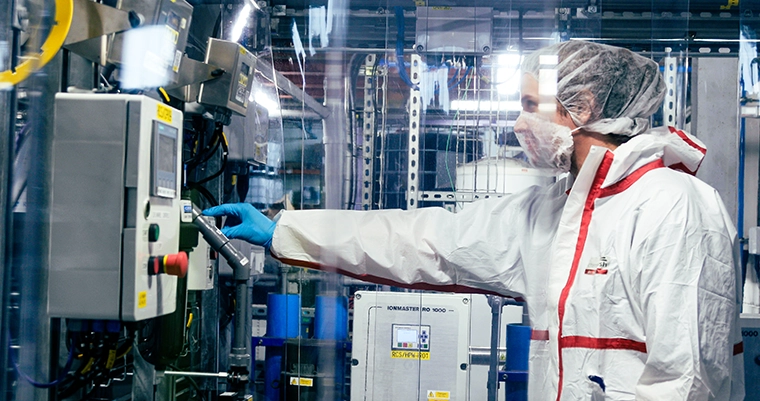 ReAgent employee wearing PPE in a cleanroom