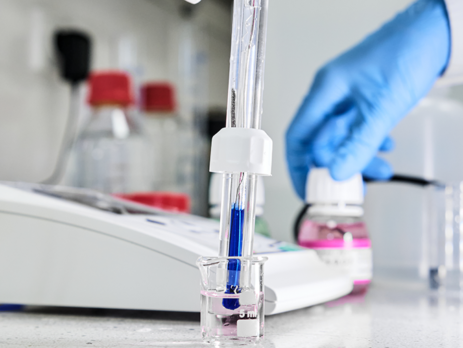 Scientist measuring the pH of a solution using a pH meter