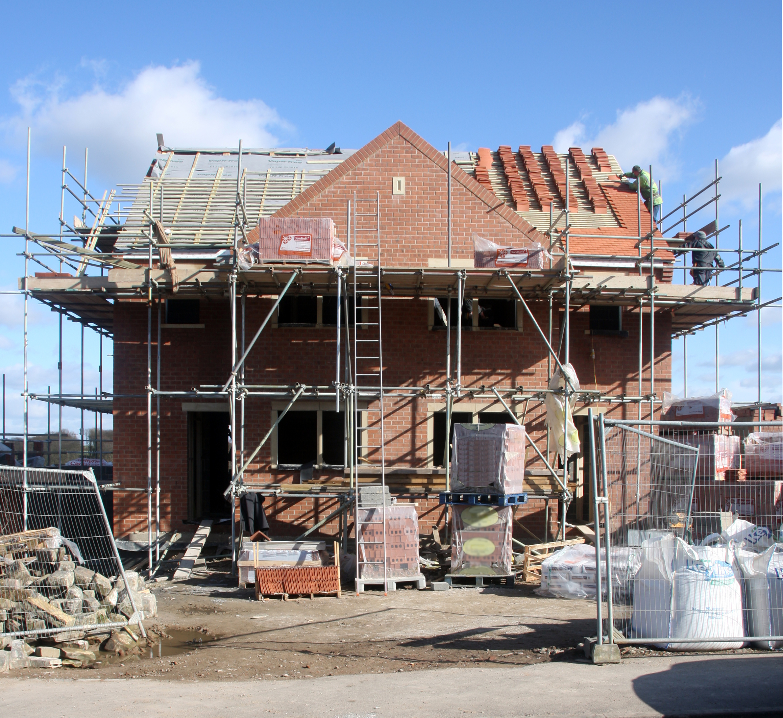 A house covered in scaffolding under construction