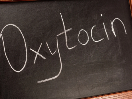 The word 'oxytocin' written on a blackboard
