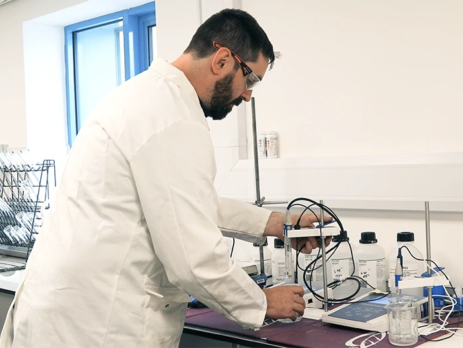 Testing water using chemistry lab equipment