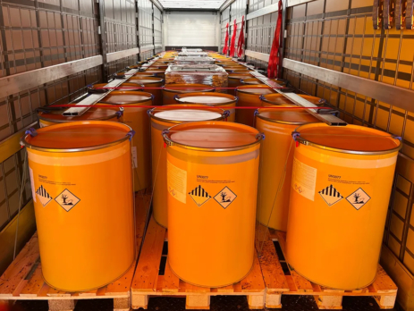 Drums of hazardous goods in a container