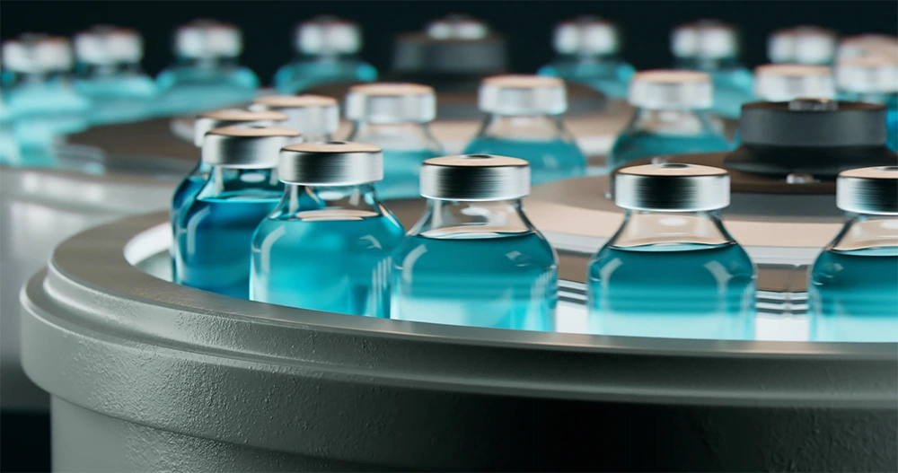 blue vaccine vial filling on a conveyor belt