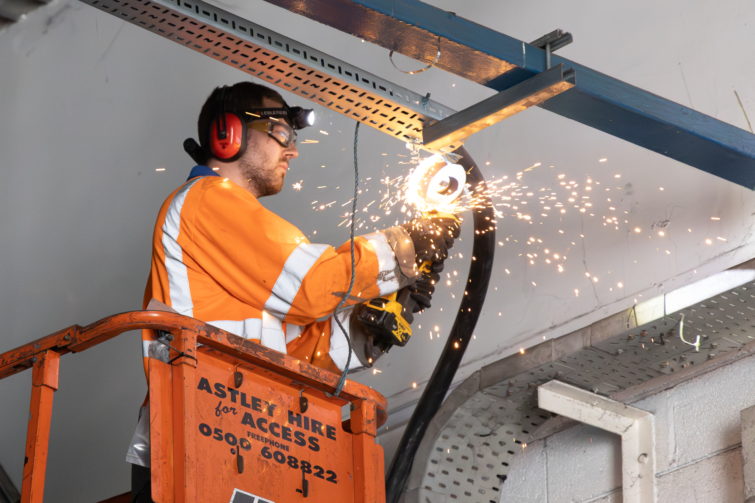 Person welding, wearing PPE