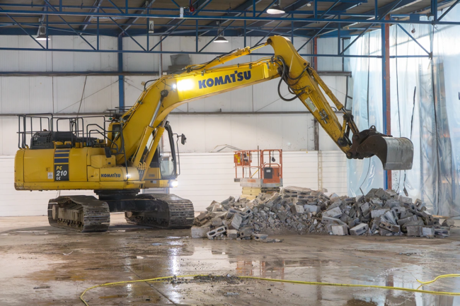 Photo of excavator demolishing walls during ReAgent's expansion