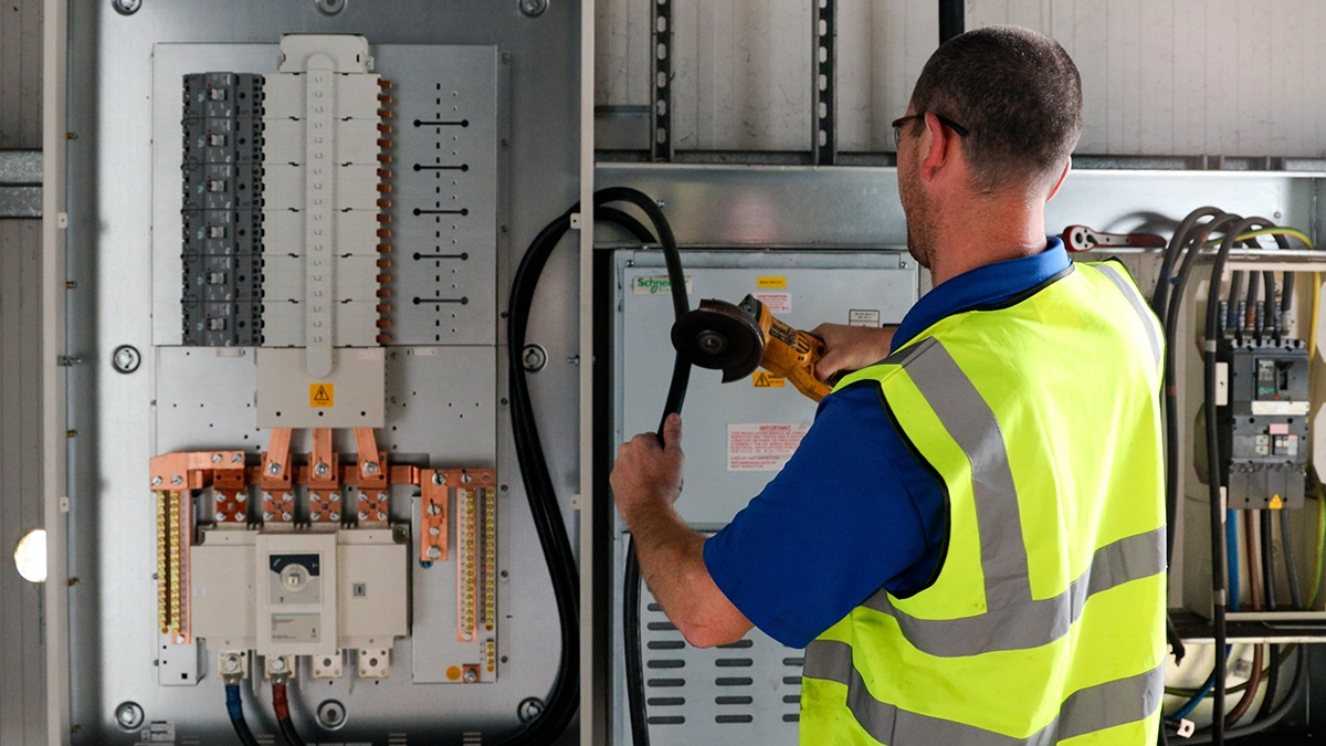 Electrician repairing distribution board