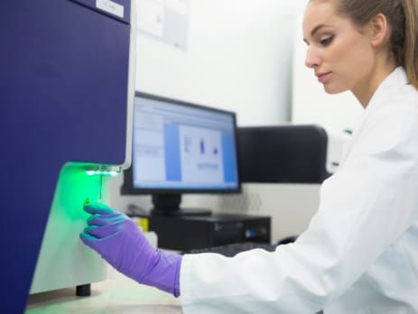 Woman using different applications of XRF in pharmaceuticals manufacturing
