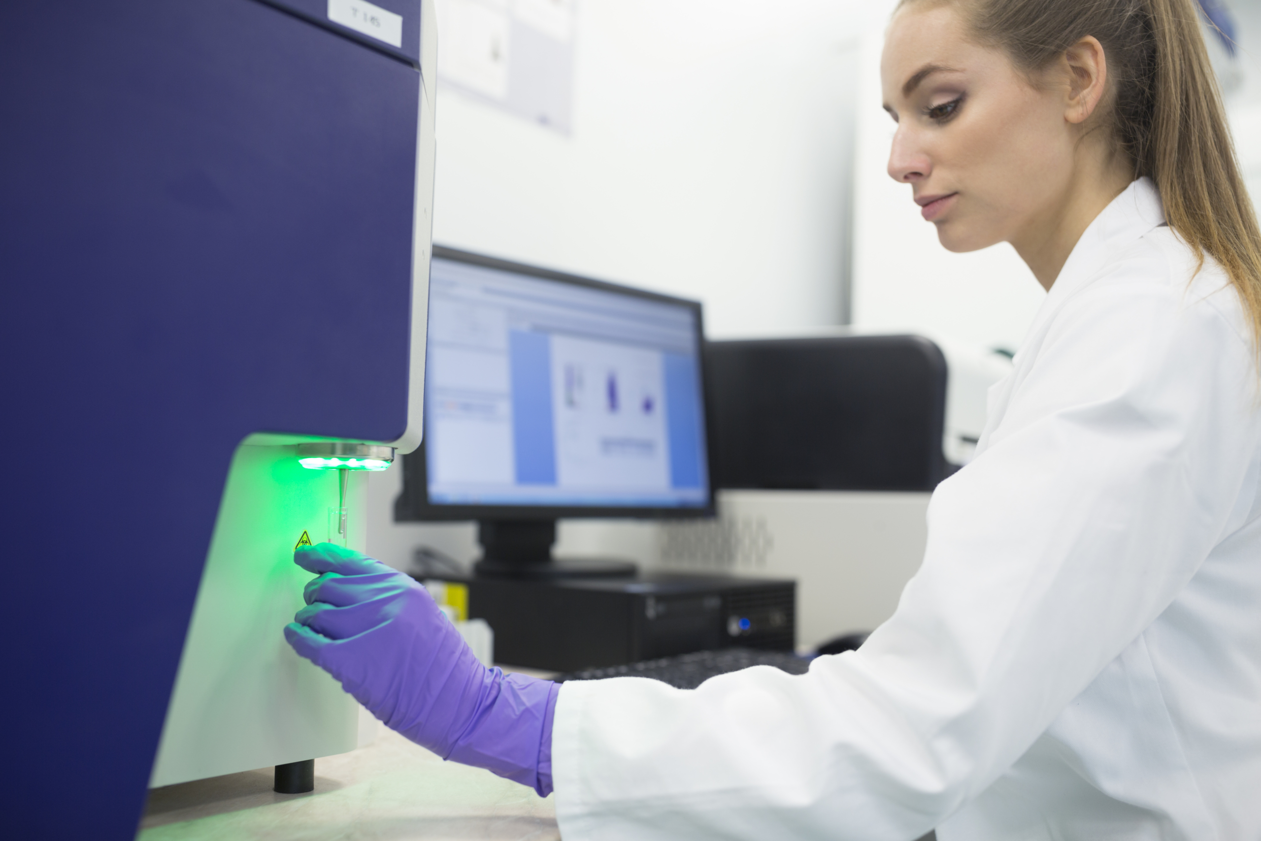 Woman using different applications of XRF in pharmaceuticals manufacturing