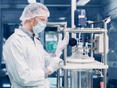 Scientist performing pharmaceutical calibrations and instrumentation upgrades