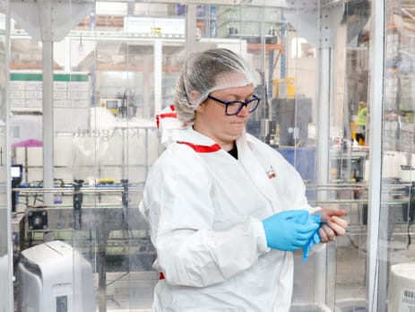 Lab technician following cleanroom standards