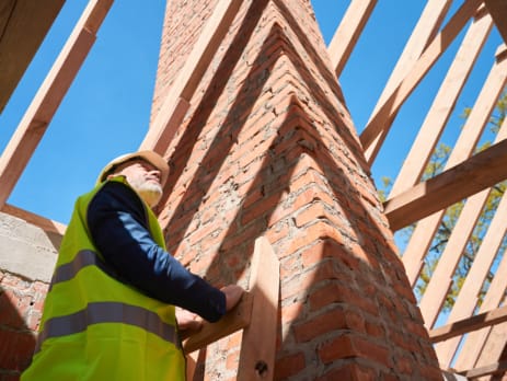 Construction workers building a house