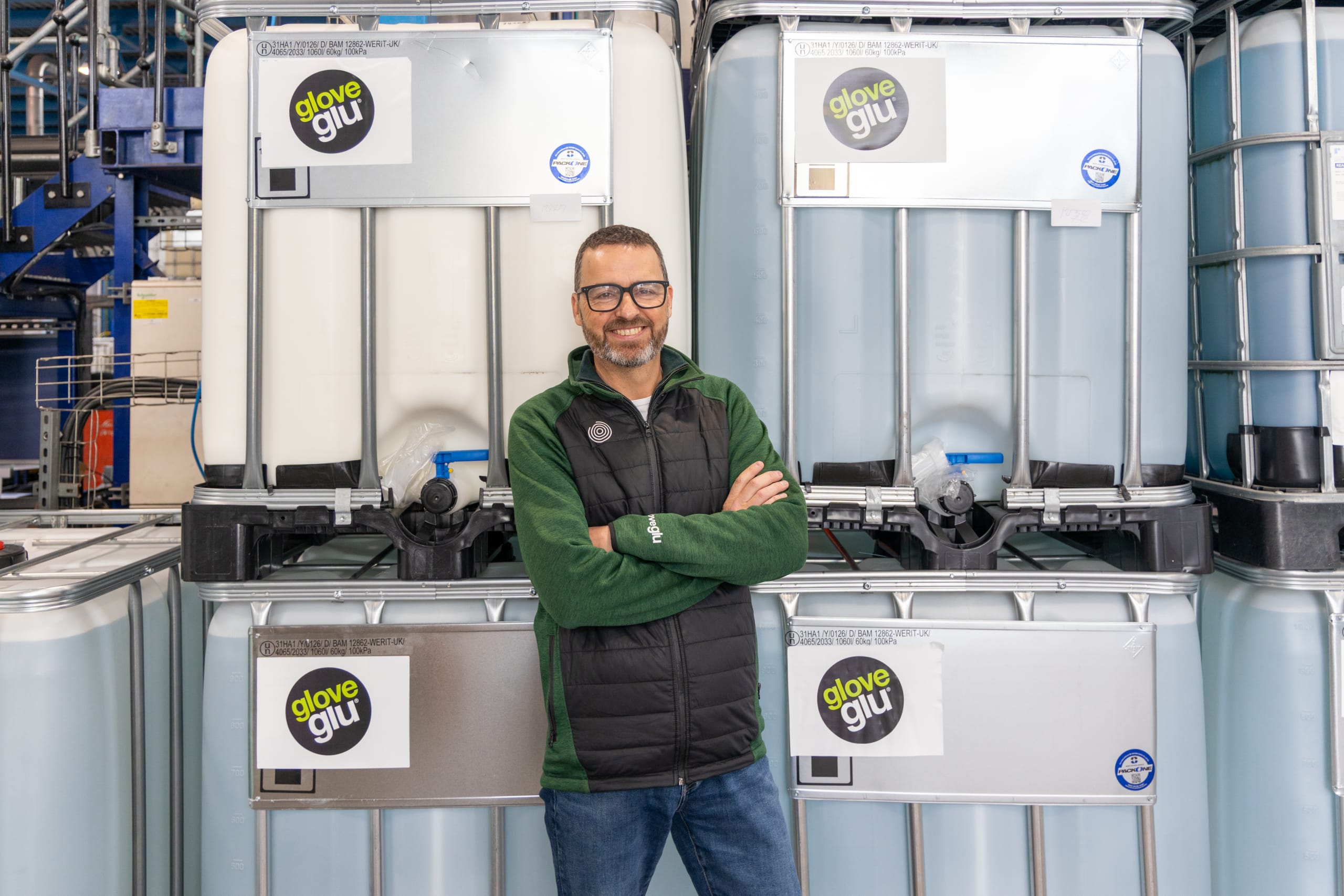 Paul Sherratt, CEO of gloveglu in front of IBCs