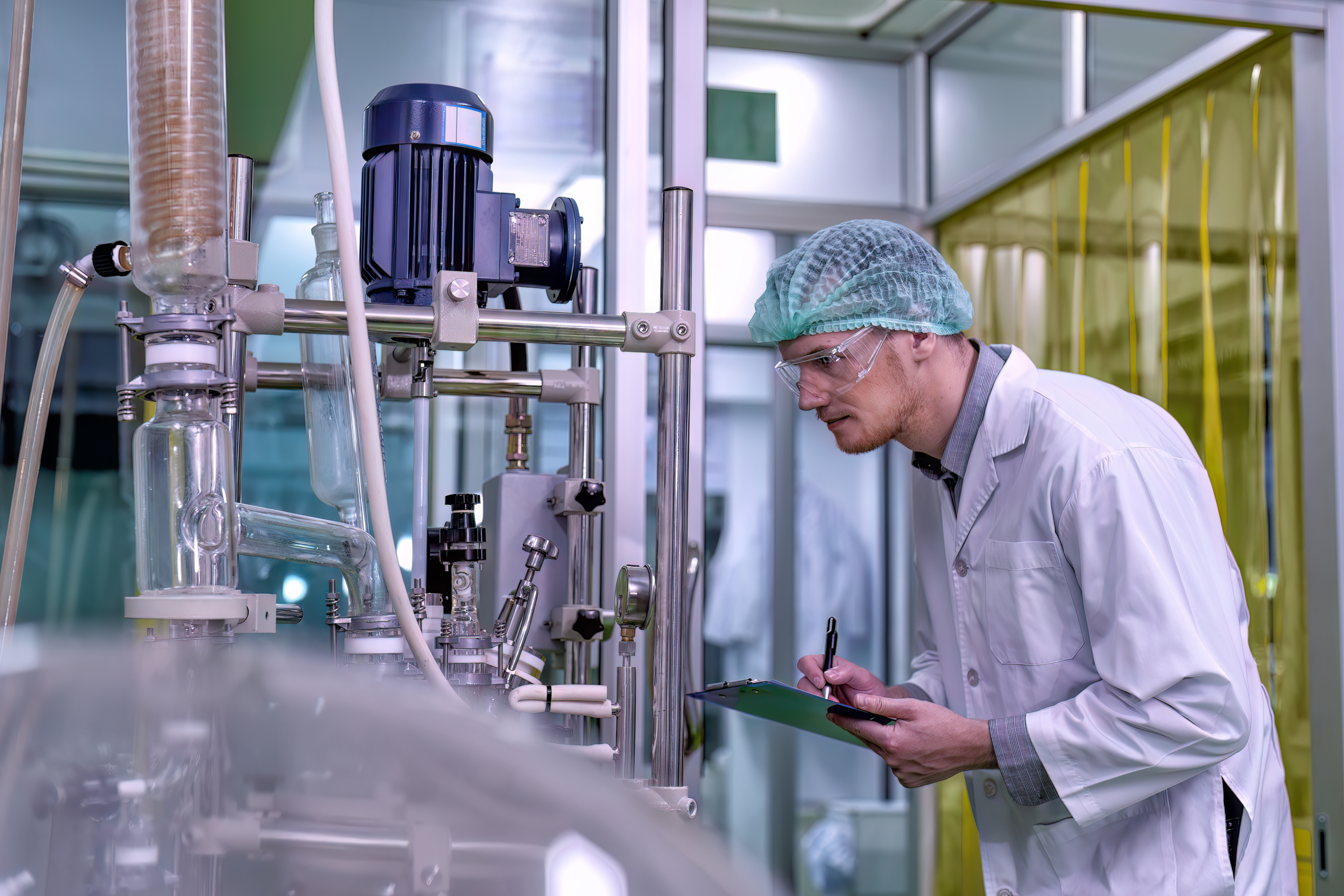 Chemist performing quality control In automotive chemical manufacturing