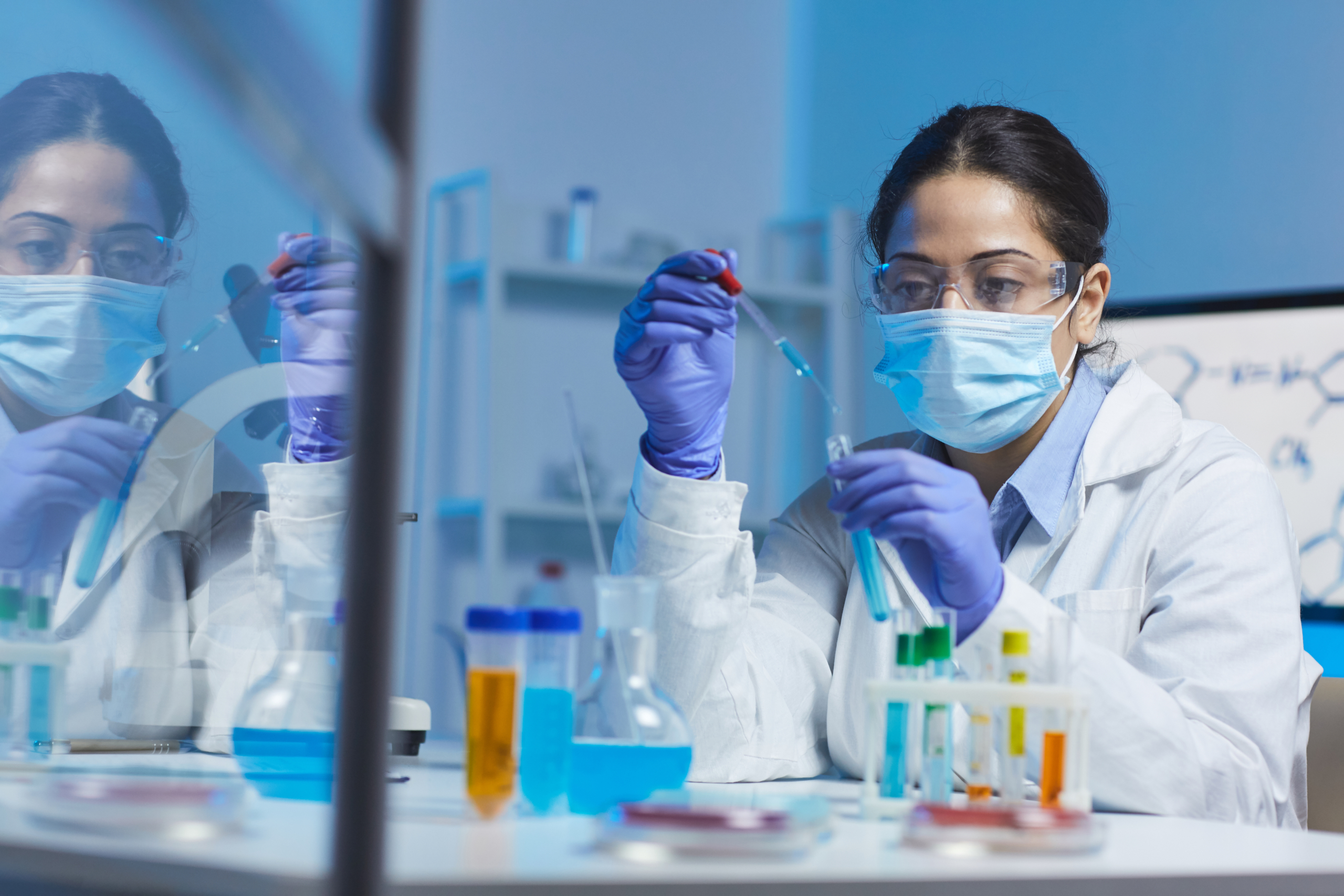 Chemist in lab testing reagents and substrates