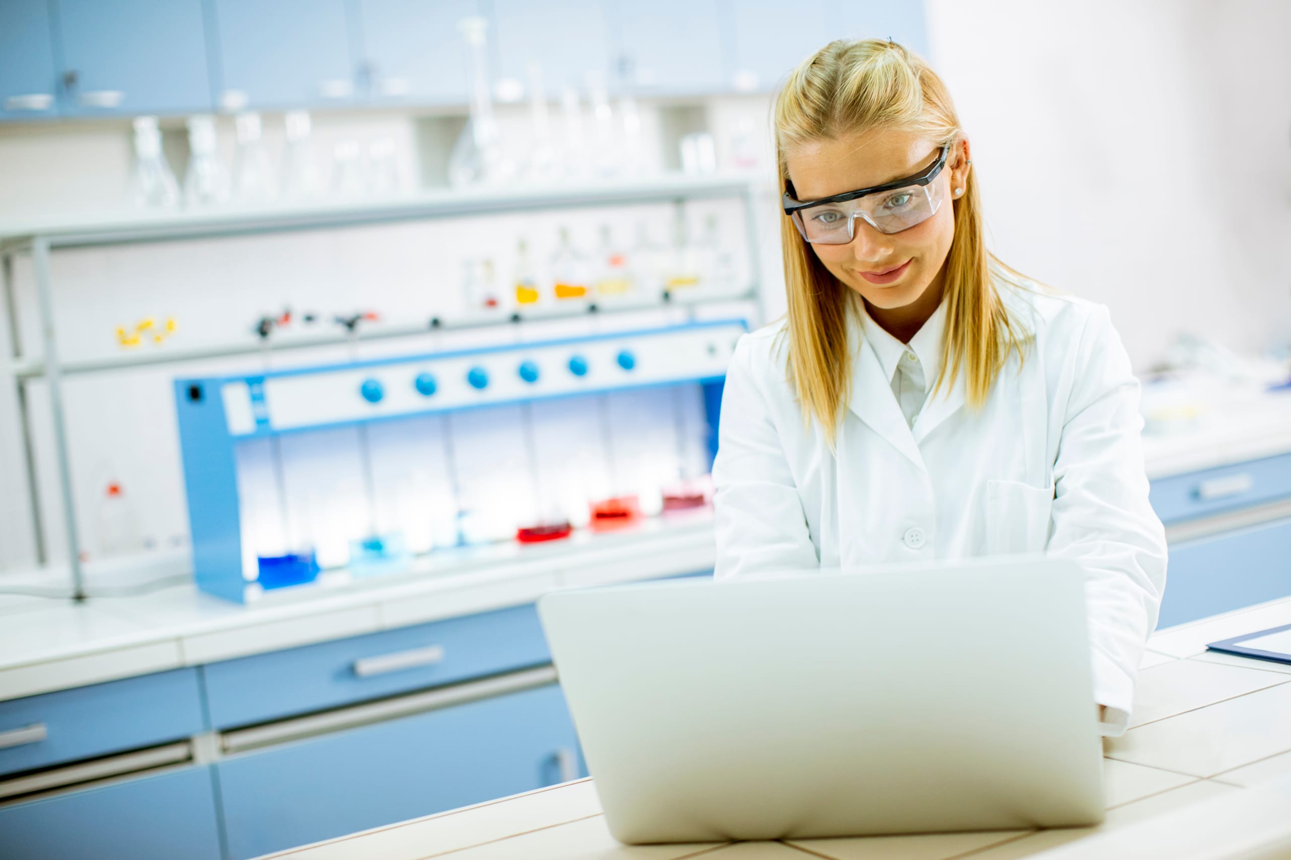 Chemical lab engineer working on a laptop