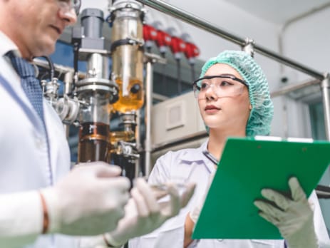 Chemists performing quality check at chemical plant