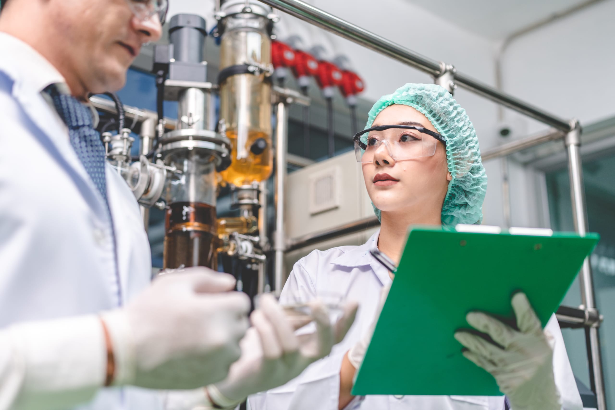 Chemists performing quality check at chemical plant