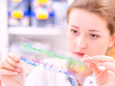 Scientist examining a spectroscopy picture in a lab