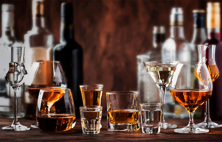 Various glasses of different types of alcohol