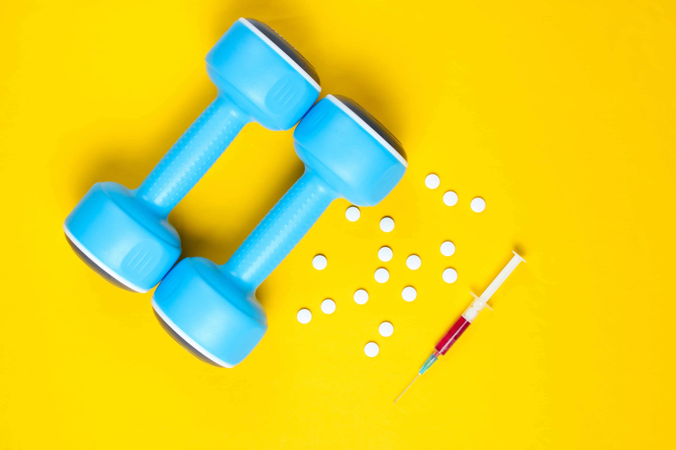 A set of dumbbells alongside a steroid injection and white tablets||Chemical Structure of Steroids||Chemical Formula of Testosterone||How Are Corticosteroids Used?||How Do Steroids Word?||What Are Steroids?