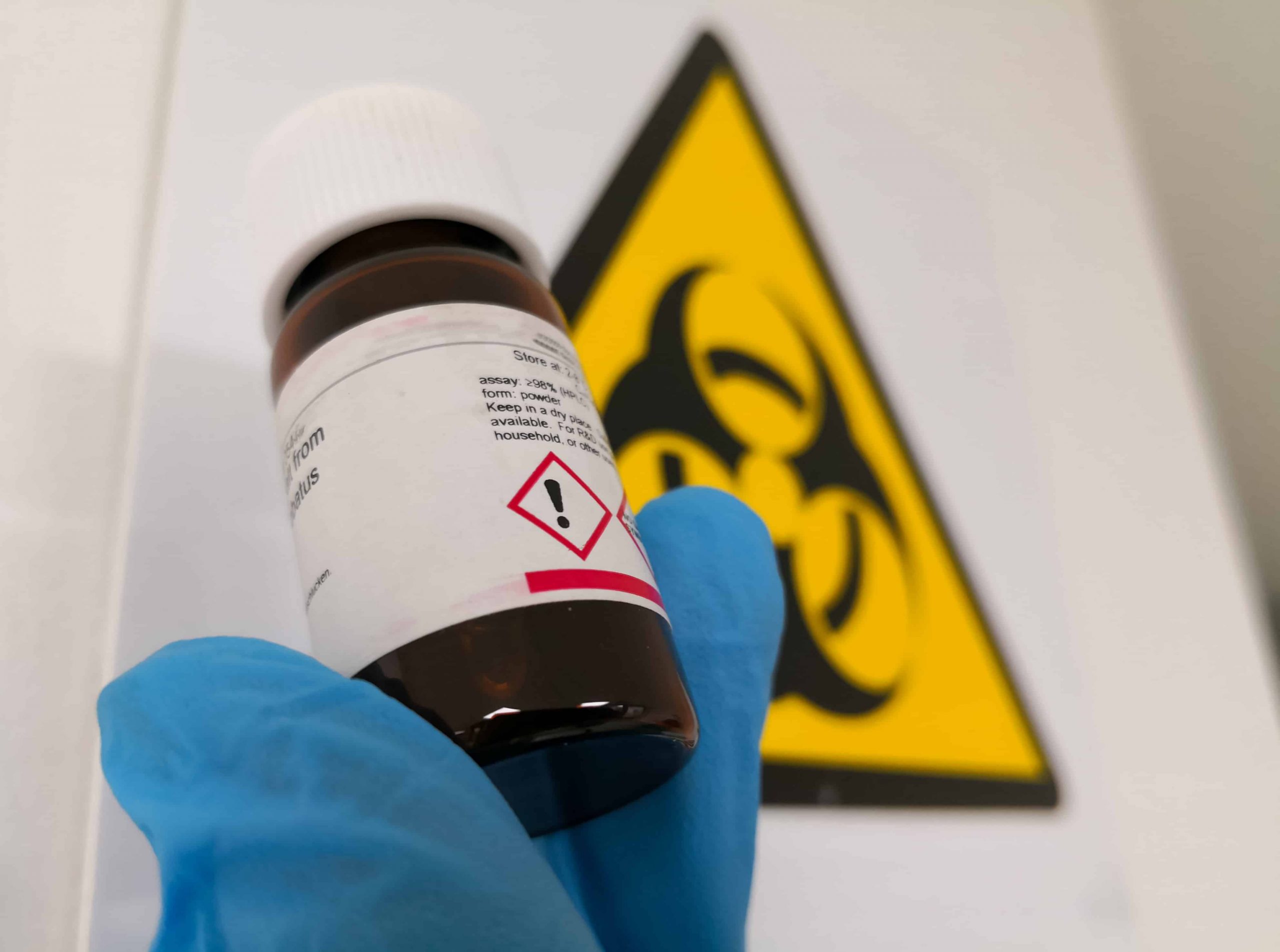 Small bottle of medicine with a hazard label