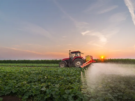 Tractor spraying pesticides onto a vegetable field||Illustration of a person wearing a gas mask changing reality into clear and healthy future.||Water being poured into a glass||The 12 Principles of Green Chemistry