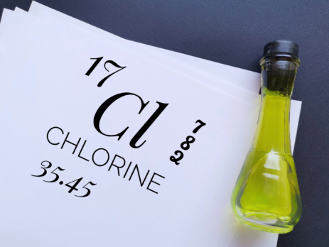 Chlorine chemical element typed on paper next to vial of liquid chlorine||Chemical equations for the chlor-alkali membrane electrolysis process||Chlor-alkali membrane process||Chlorine highlighted on the periodic table of elements||Example of a double displacement reaction between manganese dioxide and hydrochloric acid||Person pouring chlorine into swimming pool